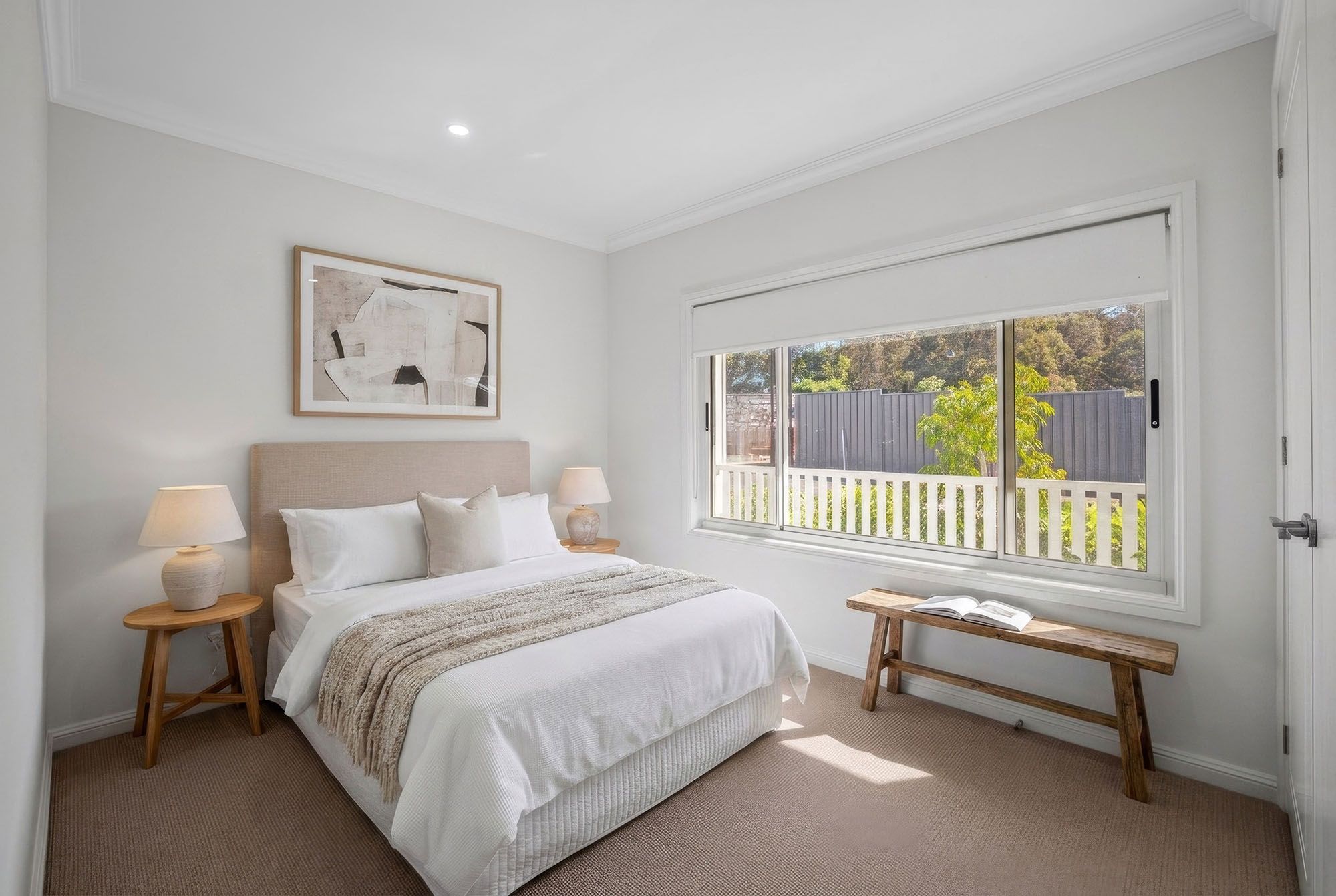 Light-filled bedroom in an architect-designed home at Woodside Bundanoon.