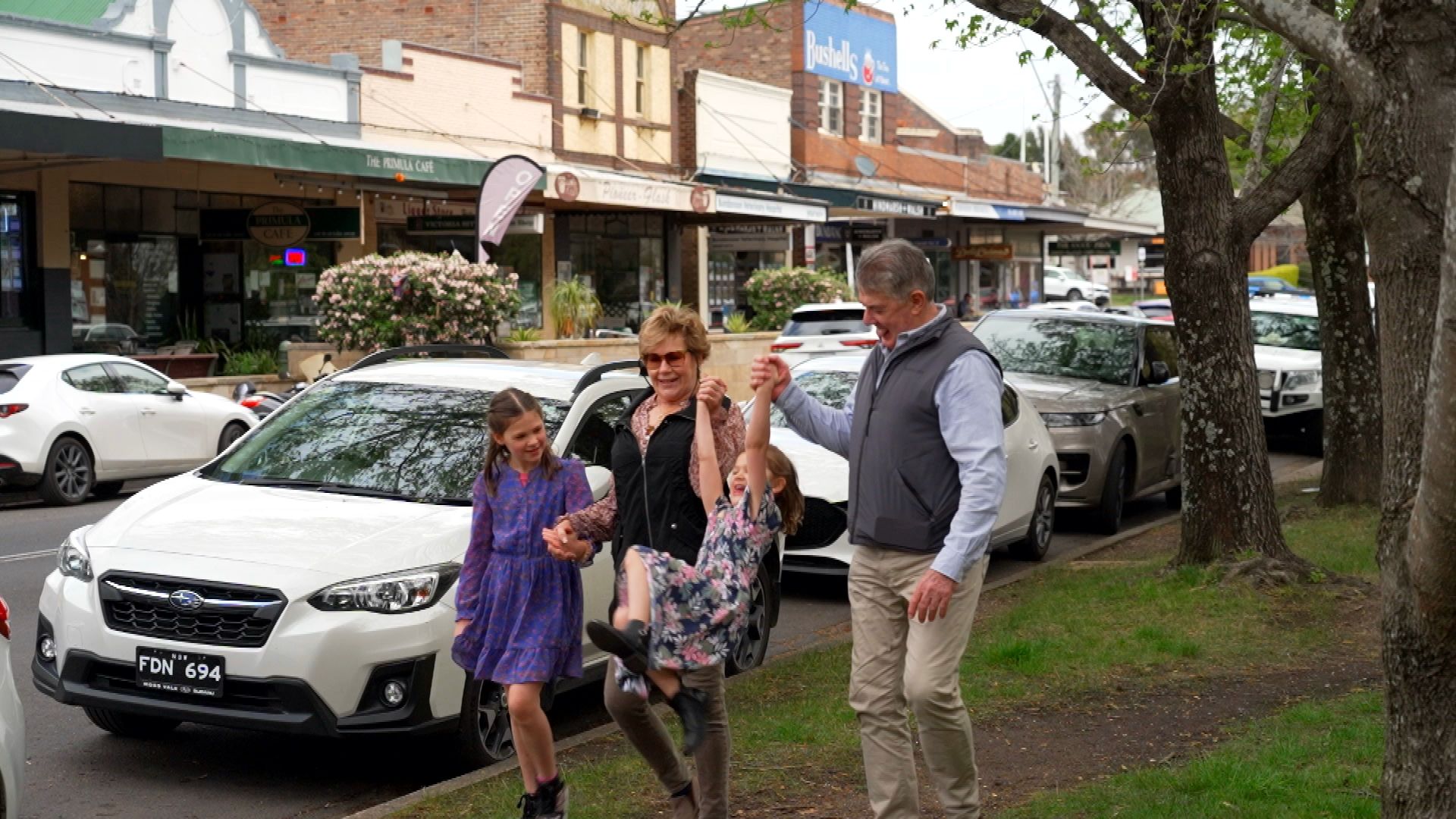 A couple enjoying time outdoors with their two grandchildren in Bundanoon village, Southern Highlands.
