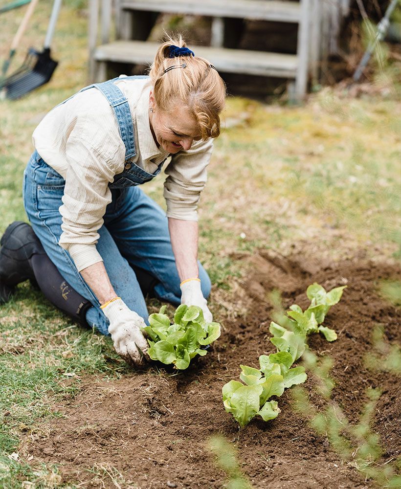 Retired woman working in the garden